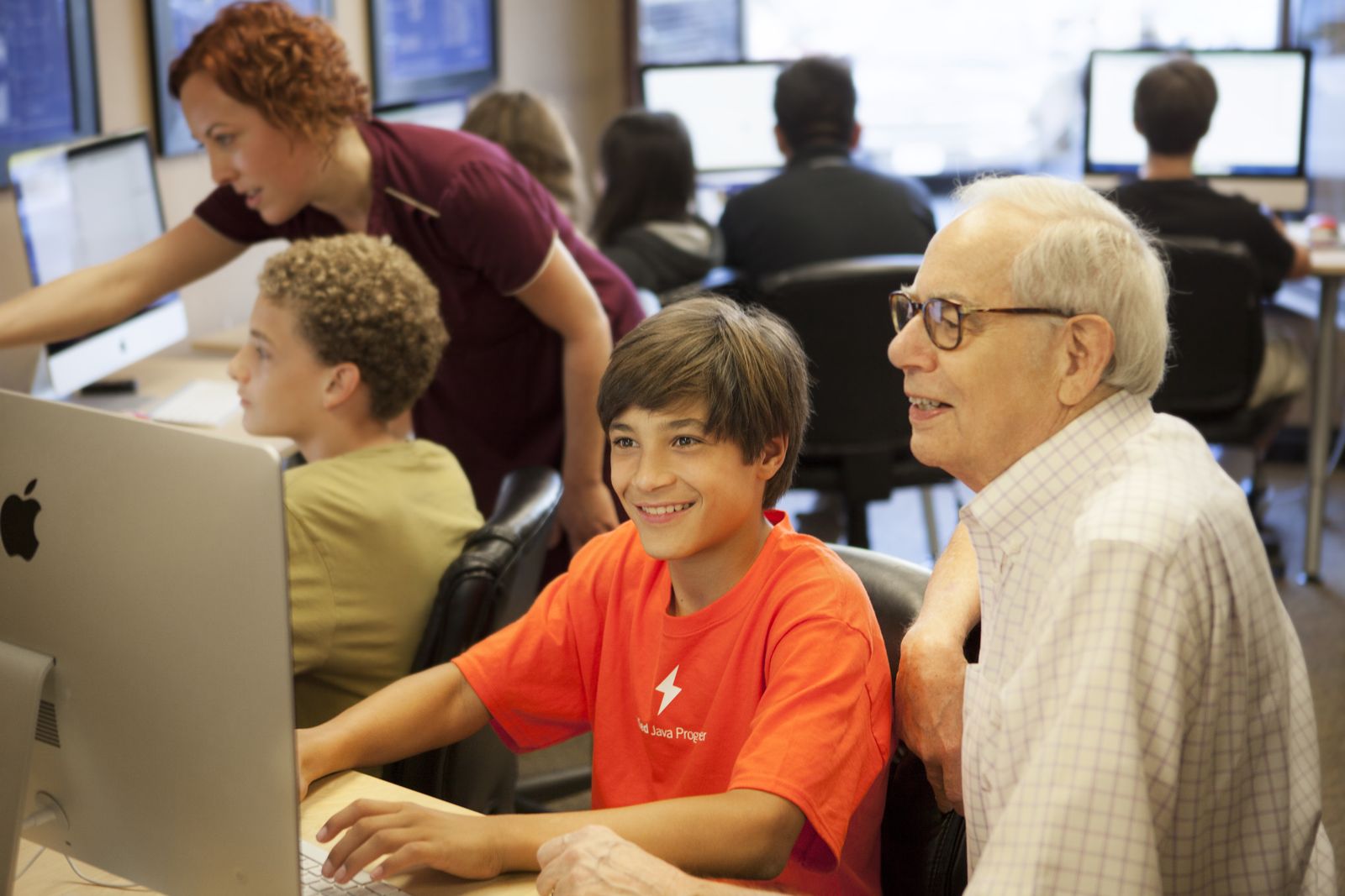 Student and mentor at a laptop